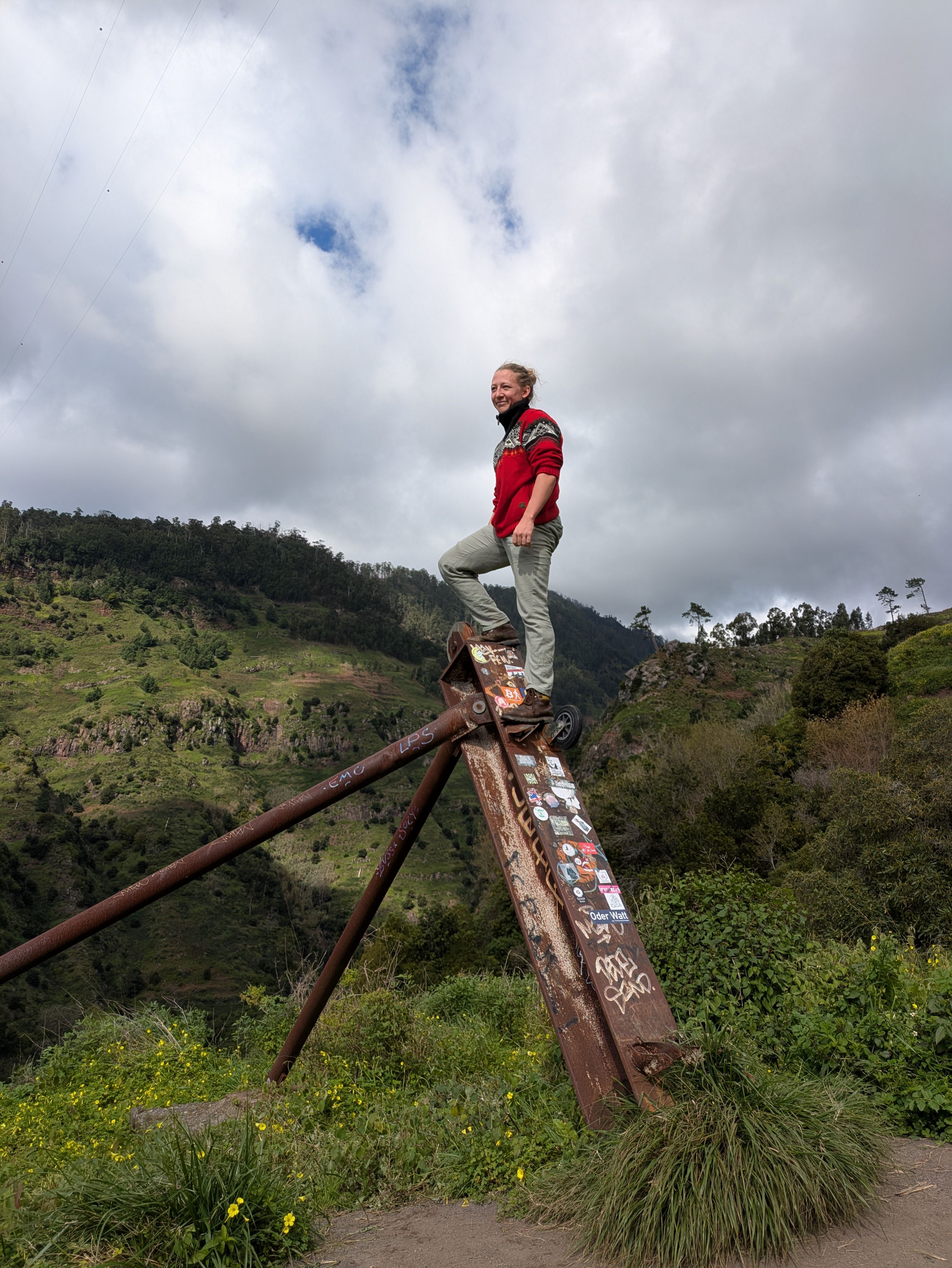 Standing on a metal platform in the mountains