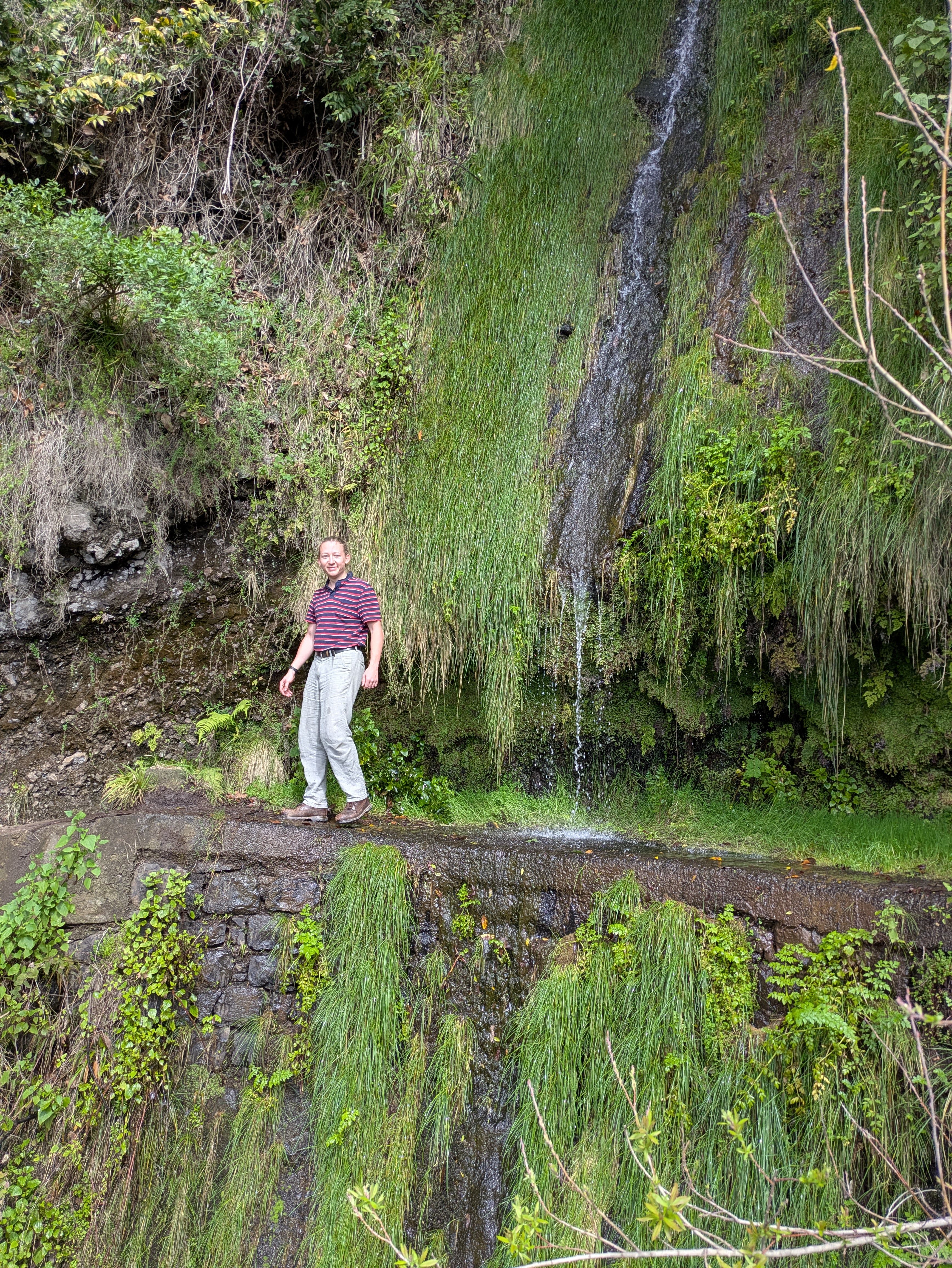 Standing in front of a waterfall